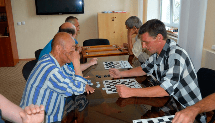 a game of checkers to distract from the beer addiction